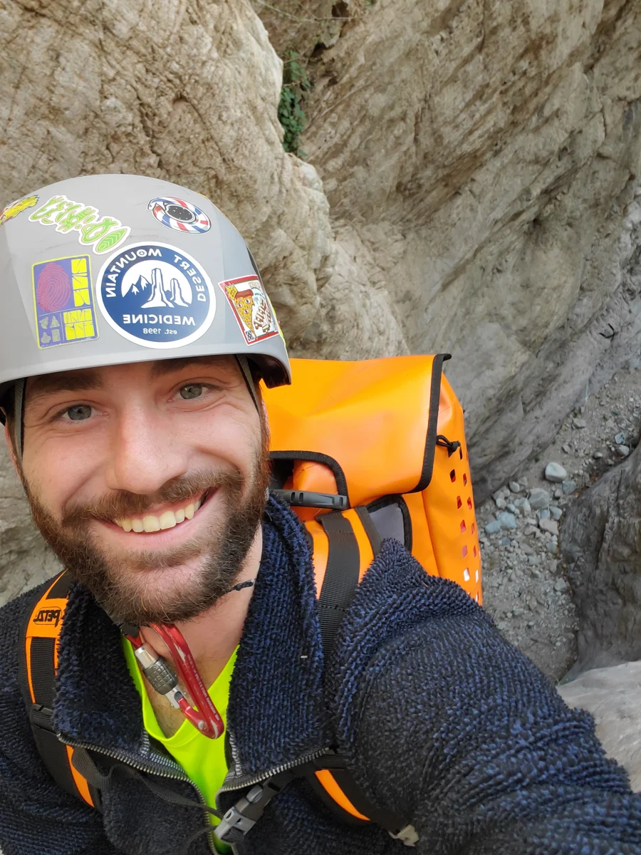 Jason Weber smiling in a narrow sandstone canyon